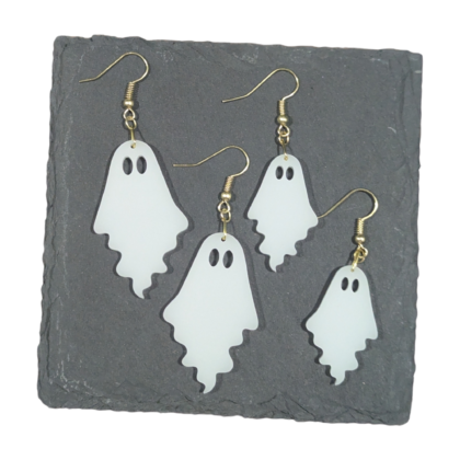 Gold Large and Small Ghostie earrings displayed on a slate tile for contrast